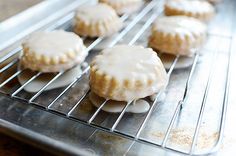 some glazed donuts are cooling on a metal rack in the oven and ready to be baked