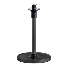 a black metal pole with a white light on it's end and a round base