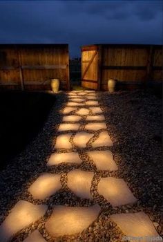 an image of a path made out of stones with the caption genius line a pathway with rocks painted in glow in the dark