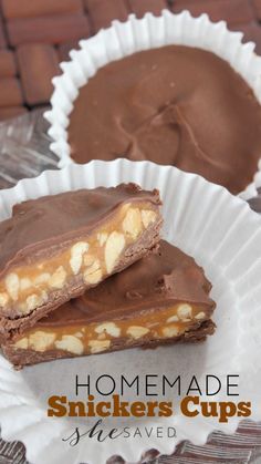 two homemade snickkers cups sitting on top of a paper plate