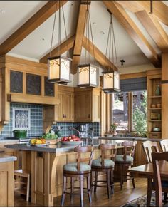 a kitchen filled with lots of wooden furniture