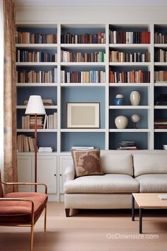 a living room filled with lots of bookshelves next to a couch and coffee table