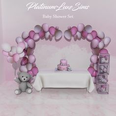 there is a baby shower set with balloons and a teddy bear next to the table