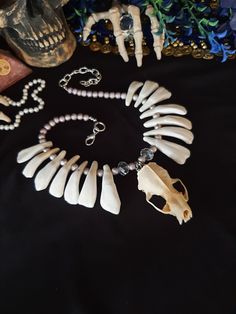 "Have a Look at This Beautiful Mink Skull Necklace! There are 14 Real Buffalo Teeth Beaded on this Necklace, With Pink Beads and Glass Beads. The Mink Skull is in great Shape, Teeth Are Glued Well. This Necklace was Strung With 40 LB Test Braided Line. Chances of Breaking are Slim. It is Adjustable from 20 - 25 Inches. All Items Ship Within 1-3 Days via USPS First Class Service. Shipping On This Necklace is Free! (USA ONLY) International Shipping Will Be 25.00, And All Additional Items Add 1.00 Horn Bracelet, Wiccan Necklace, Queen Jewelry, Teeth Jewelry, Braided Line, Tooth Necklace, Bone Necklace, Fairy Jewelry, Bone Jewelry