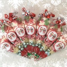 a bunch of candy canes with christmas decorations on them