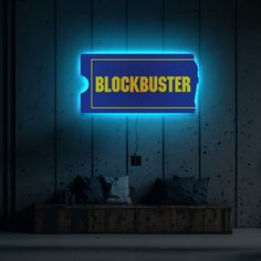 a blue sign that says blockbuster on it in front of a wooden wall