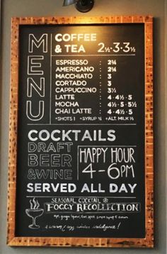 a menu board is hanging on the wall