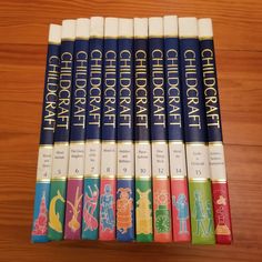 six children's books sitting on top of a wooden table