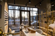 a living room filled with furniture and a large window covered in frosted glass doors