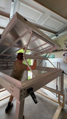 a man is working on some kind of metal structure