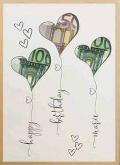 two balloons with money in the shape of hearts