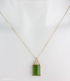 "Here is a AAA grade Siberian emerald green nephrite jade set in solid 18KT yellow gold and accented with round full cut white diamonds. This pendant is designed with a chevron accent. It is modern with simple clean lines. The jade is natural and untreated. This nephrite jade has a beautiful glowing apple green color. Stone & Dimensions: Natural Untreated gem grade AAA Siberian Emerald Green Nephrite Jade: approximately 11.2 carats 16mm long x 12mm wide x 5mm thick, Overall size of pendant: Elegant Rectangular Jade Necklace, Elegant Green Rectangular Emerald Necklace, Elegant Dark Green Jade Jewelry, Green Rectangular Stone Jewelry For Formal Occasions, Formal Green Jewelry With Rectangular Stone, Green Rectangular Necklace For Formal Occasions, Formal Green Rectangular Necklace, Rectangular Green Jade Jewelry, Green Rectangular Jade Jewelry