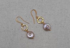 Cultured beige/ blush pink coin pearls dangle from textured plated gold discs. Plated gold French ear wires. Length is near 2 in. Coin Pearls are 1/2 inch diameter. Perfect gift for birthday, Anniversary, Mother's Day, or Valentine's Day. Beautiful bride or bridesmaid earrings for traditional or boho chic wedding. Gifting storage box included with purchase. Gold Nickel-free Pearl Earrings, Adjustable Gold Pearl Earrings For Party, Gold Hammered Pearl Earrings Gift, Gold Pearl Earrings Nickel Free For Party, Gold Nickel-free Pearl Earrings For Party, Gold Pearl Earrings For Party, Nickel Free, Gold Hammered Dangle Pearl Earrings, Nickel-free Gold Pearl Earrings For Wedding, Pine Jewelry