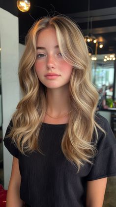 Sandy blonde is a soft, sun-kissed shade that beautifully enhances pale skin, offering a natural and effortless look. This versatile color adds warmth and brightness, perfect for achieving that beachy vibe year-round. Click the pin for more inspiration and follow us for the latest hair color trends! #SandyBlonde #BeachyHair #HairColorInspo #BlondeGoals #PaleSkinPerfection Sun Kissed Strawberry Blonde Hair, Light Neutral Skin Tone Hair Color, Honey Blonde On Pale Skin, Strawberry Blonde Hair On Pale Skin, Highlights Pale Skin, Best Blonde For Pale Skin, Pale Skin Blonde Hair, Sandy Blonde Highlights, Hair Color For Pale Skin