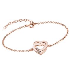 Customize our Interlocking Adjustable Hearts Bracelet with 18K Rose Gold Plating with meaningful words, or add a name to each heart! This beautiful bracelet is personalized to order, using our classic printed font. An extension makes it simple to find a fit feels just right. This exquisite bracelet is handcrafted of 18k Rose Gold Plated Sterling Silver. Features include: 2 intertwined hearts 1 name or word per heart Traditional print font 18k Rose Gold Plated Rollo chain bracelet with 1.5” exte Custom Engraved Bracelet, Best Gift For Wife, Two Hearts, Heart Shape Pendant, Engraved Bracelet, Personalized Bracelets, Love Bracelets, Heart Bracelet, Silver Rose Gold