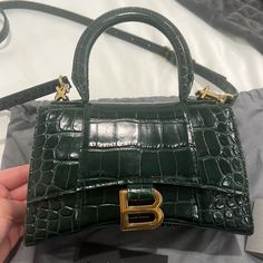 Dimensions : L7,4 X H5,1 X W3,1 Inch Shiny Crocodile Embossed Calfskin Hourglass Shape Curvilinear Base Long Flap Adjustable And Removable Crossbody Strap (21,6 Inch) 1 Handle Studded Magnet Closure Aged-Gold B Hardware (Brass) 1 Back Pocket Nappa Lambskin Lining Made In Italy Wipe With A Soft Cloth Material: 100% Calfskin Gently Used. Includes Dust Bag Designer Crossbody Bag With Crocodile Pattern, Classic Green Crocodile Pattern Bag, Luxury Crossbody Bag With Crocodile Pattern, Luxury Crocodile Pattern Crossbody Bag, Designer Green Bag With Crocodile Pattern, Designer Shopping Bags With Crocodile Pattern, Designer Crocodile Pattern Bags For Shopping, Designer Crocodile Pattern Shopping Bags, Luxury Green Satchel