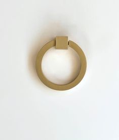 a circular object on a white surface with a light coming from it's center