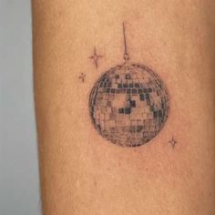 a tattoo with a disco ball on it