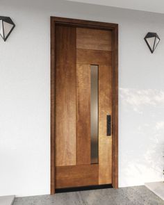 a wooden door with two lights on the side and a planter in front of it