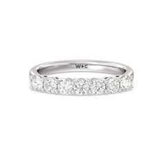 a white gold wedding band with five diamonds