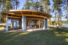 a circular house with glass doors on the outside