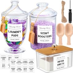 two clear containers with labels and wooden spoons next to them are labeled laundry pods