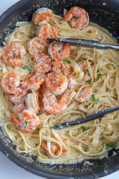 pasta with shrimp and parmesan cheese in a skillet, ready to be eaten