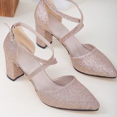 These rose gold high heels are stylish and comfortable. The sleek design of the crisscross strap provides a secure fit, while the chic rose gold glitter color adds a touch of extraordinary chicness to any outfit. High-quality rose gold glitter vegan leather. To protect your shoes from dampness, apply a waterproof spray when they're new. For cleaning, use a mild soap solution and wipe the surface with a damp cloth that has been wrung out." Rose Gold Glitter Heels, Rose Gold Wedding Shoes, Rose Gold High Heels, Cross Heels, Heels Rose Gold, Glitter Wedding Shoes, Unique Wedding Shoes, Gold Glitter Heels, Gold High Heels