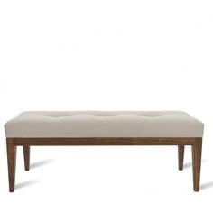 the bench is made from wood and has a light colored upholstered fabric on it