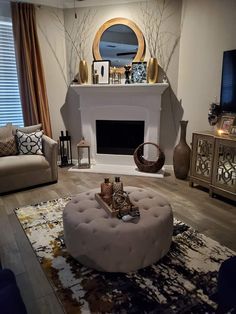 a living room filled with furniture and a fire place