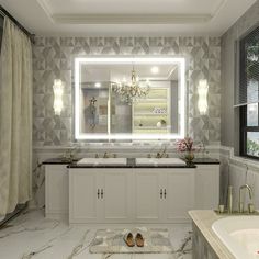 a bathroom with two sinks and a large mirror in it's center, next to a bathtub