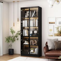 a living room filled with furniture and a book case