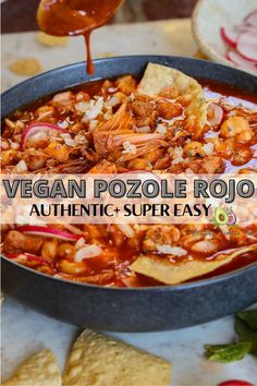 vegan pozole rojo recipe in a skillet with tortilla chips