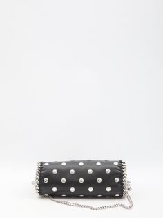 This black vegan fabric Falabella mini tote bag is adorned with all-over studs. It boasts a silver-tone diamond-cut chain, two top handles, one shoulder strap, magnetic closure, and one main interior compartment with an additional slip pocket.    Dimensions: 10x9.2x3.9 inches   Vegan fabric  All over studs  Two top handles  Magnetic closure  Slip pocket  Product code: 371223WP04541000  Composition: 51% polyester, 49% polyurethane Black Studded Evening Bag, Formal Black Shoulder Bag With Studs, Black Studded Shoulder Bag For Party, Valentino Garavani Bag, Vegan Clothing, Zegna Shoes, Messenger Bag Backpack, Mini Tote Bag, Saint Laurent Shoes