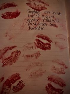 a piece of paper with lipstick drawn on it