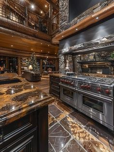 a large kitchen with granite counter tops and stainless steel stove top ovens, surrounded by stone stairs