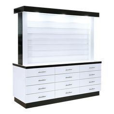 a white and black dresser with drawers