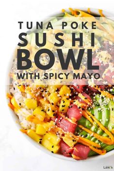 a white bowl filled with sushi bowls and topped with sliced veggies on top