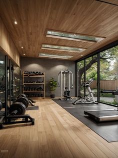 an exercise room with treadmills and other equipment