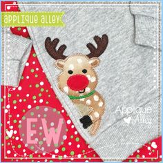 an applique sweater with a reindeer on it's chest and the words applique alley