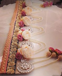 the table is decorated with flowers and pearls