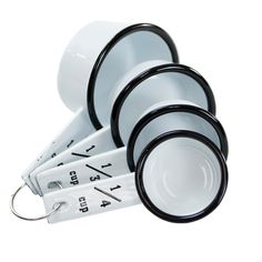 a set of measuring cups and spoons on a white background with black rims