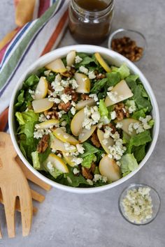 a salad with pears, feta cheese and walnuts