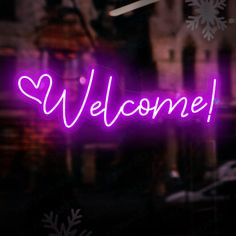 a purple neon sign that says welcome