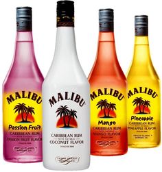 three bottles of various flavored drinks in different colors and flavors, each with a palm tree on the label