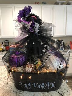 a basket filled with halloween items on top of a kitchen counter