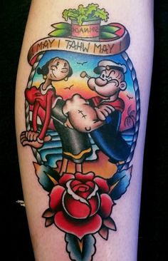 an old school style tattoo on the leg of a woman's leg, with images of cartoon characters