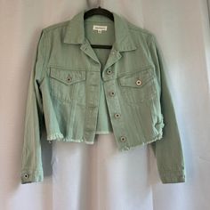 Never Worn Cropped Sage Green Denim Jacket Cropped Green Jacket, Casual Cotton Outerwear With Frayed Hem, Summer Button-up Outerwear With Frayed Hem, Spring Cropped Jacket With Frayed Hem, Spring Cropped Jacket With Pockets, Chic Spring Outerwear With Frayed Hem, Chic Cotton Outerwear With Frayed Hem, Cotton Outerwear With Frayed Hem For Day Out, Trendy Spring Outerwear With Frayed Hem