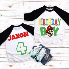 two birthday shirts with mario and luigi's name on them, one for each child