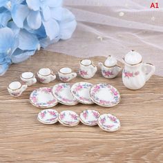 porcelain tea set with matching saucers and cups